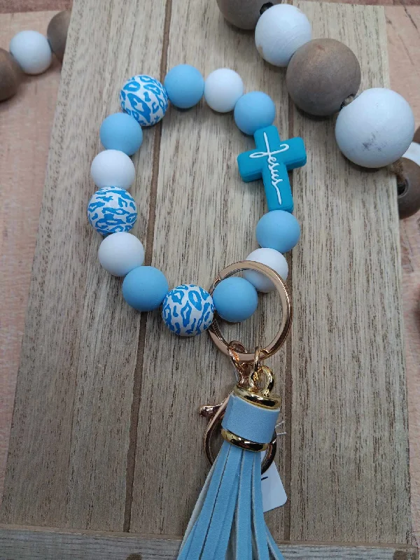 Christmas Fireplace Cozy Blue Jesus Cross Beaded Wristlet
