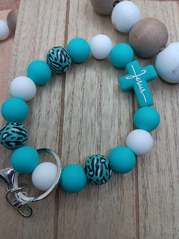 Christmas Candlelight Dinner Teal & Leopard Jesus Cross Beaded Wristlet