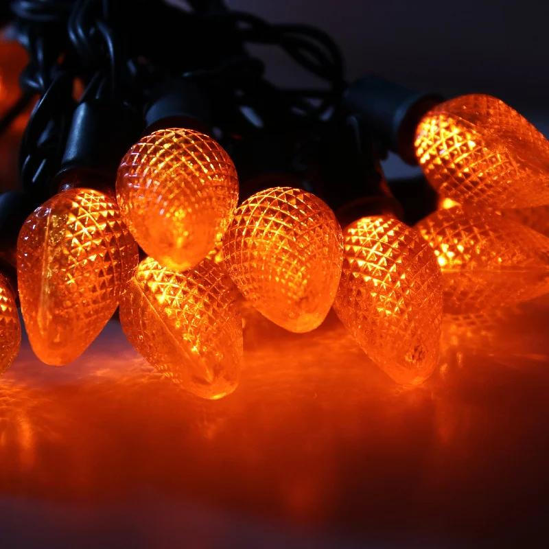 Christmas Magical Experience 25-light C7 Orange LED Christmas Lights, 8" Spacing Green Wire